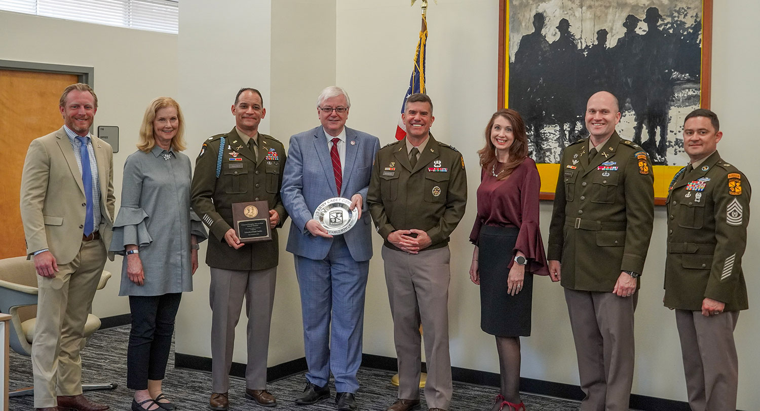 Jared Evans, Provost Arnett, Lieutenant Colonel Daniel Rausch, President Amiridis, Major General Antonio Munera, Mary Alexander, and Colonel Mike Mourouzis at the presentation of the MacArthur Award