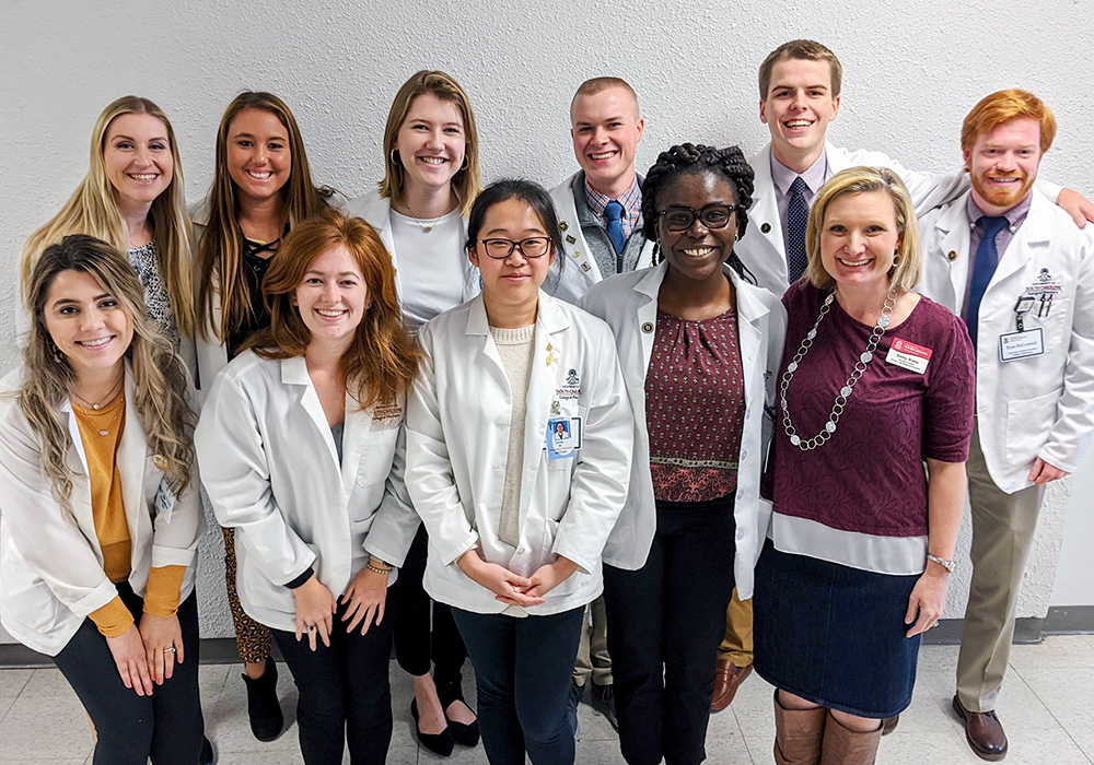 Pharmacy students pose with other students from across the health sciences