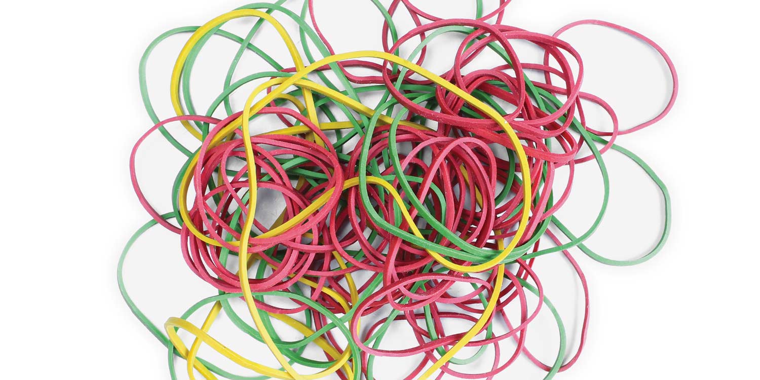 A photo of a group of colorful rubberbands isolated on a white background.