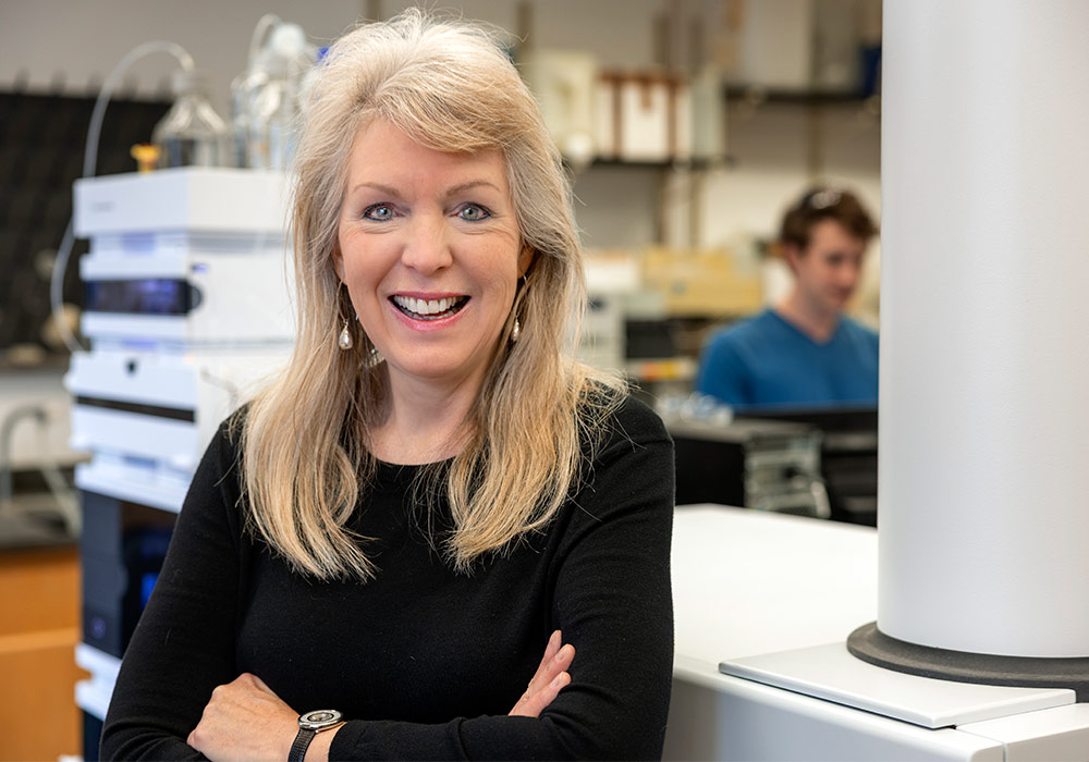 Susan Richardson stands in her chemistry lab