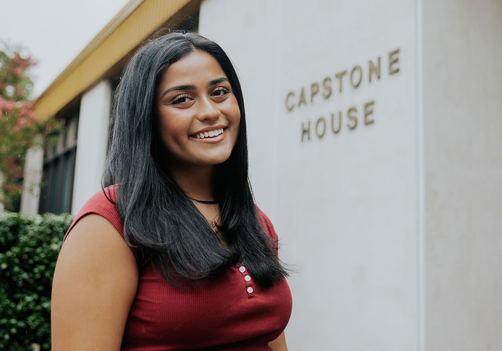 Woman standing in front of Capstone House