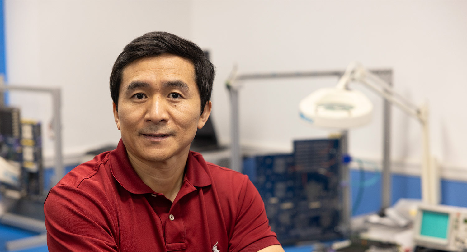 Head shot of guoan wang in his engineering lab