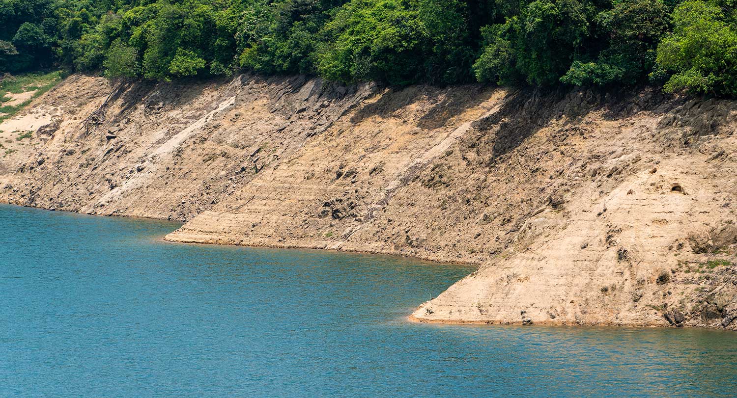 Blue water near an earthen dam