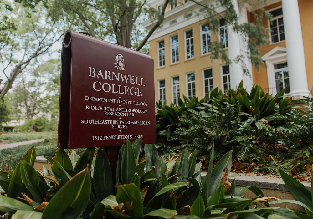 garnet sign reading "barnwell college/department of psychology/biological anthropology research lab/southeastern paleoamerican survey/1512 pendleton street" in front of beige building