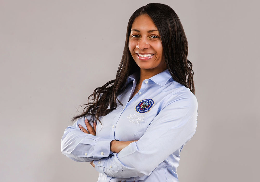 Cowart-Drayton crosses her arms in a work headshot