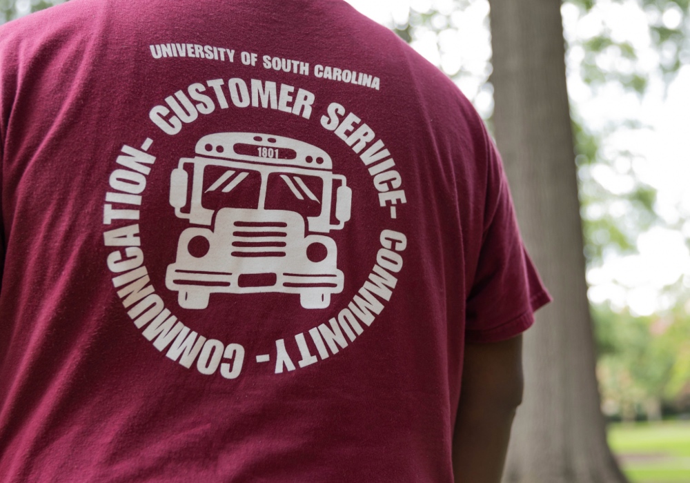 Parking and Transportation department shirt that says "Customer service-community-communication".