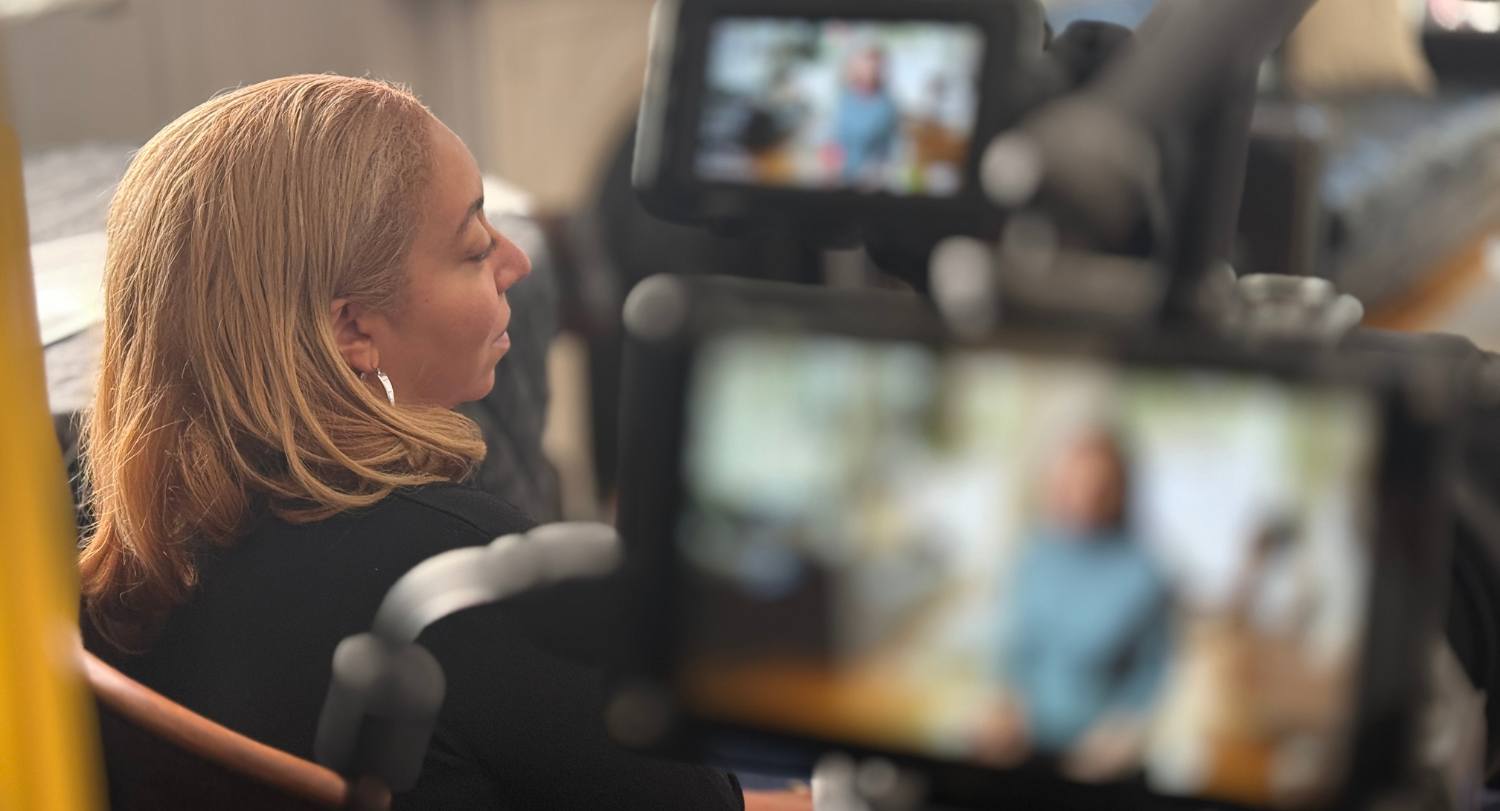 Lauren Waring Douglas interviews a documentary subject out-of-frame