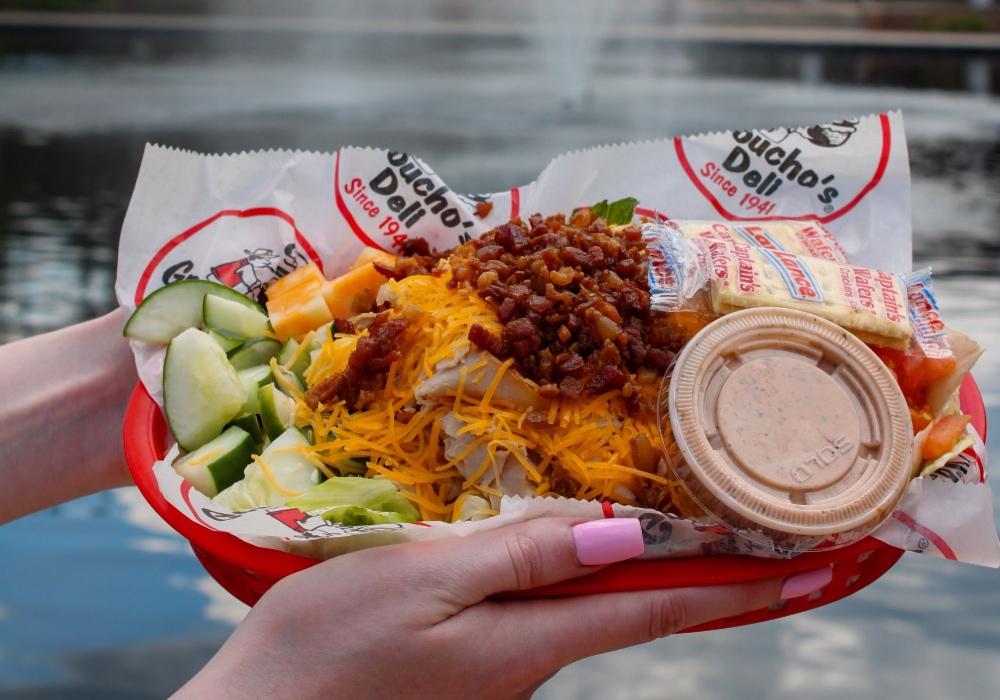 A meal from Groucho's Deli in front of the Thomas Cooper Library fountains.