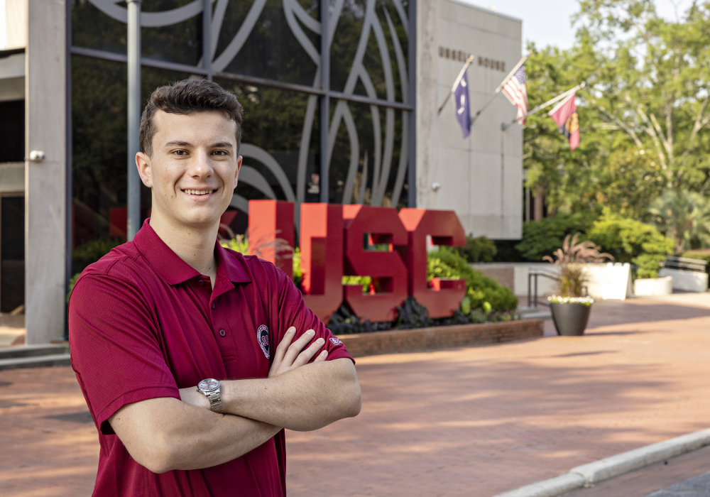 Headshot of Cole Rotondo in front of the Russell House