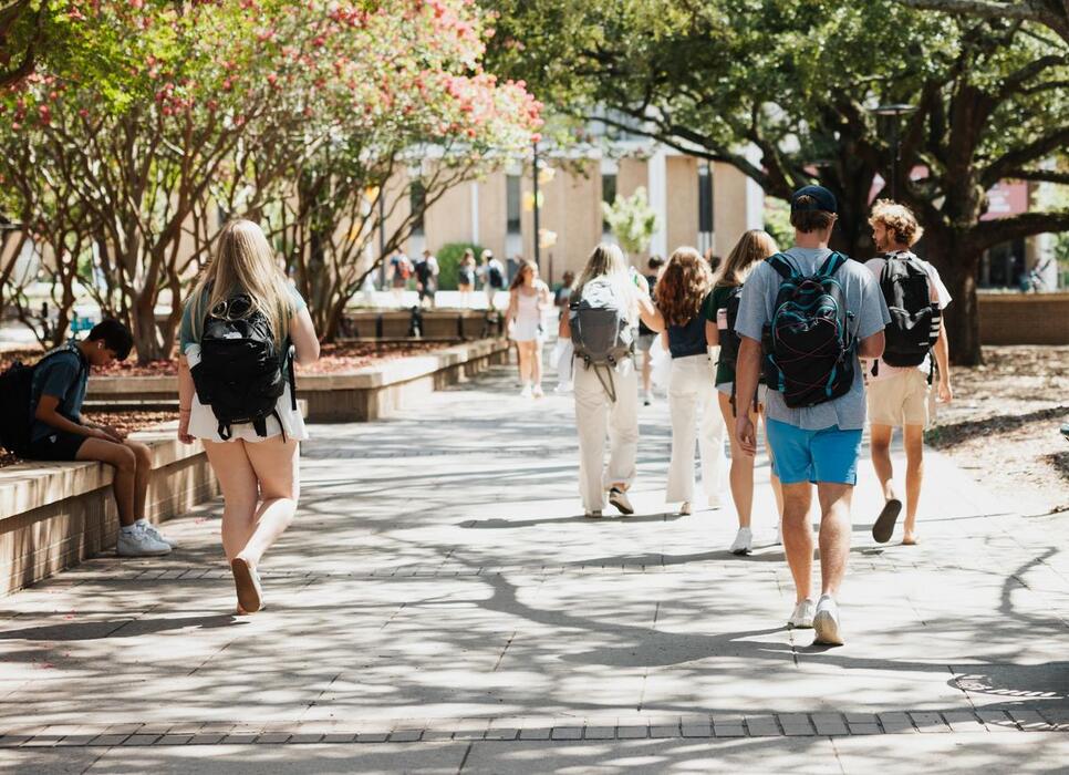 Students walking near Thomas Cooper Library