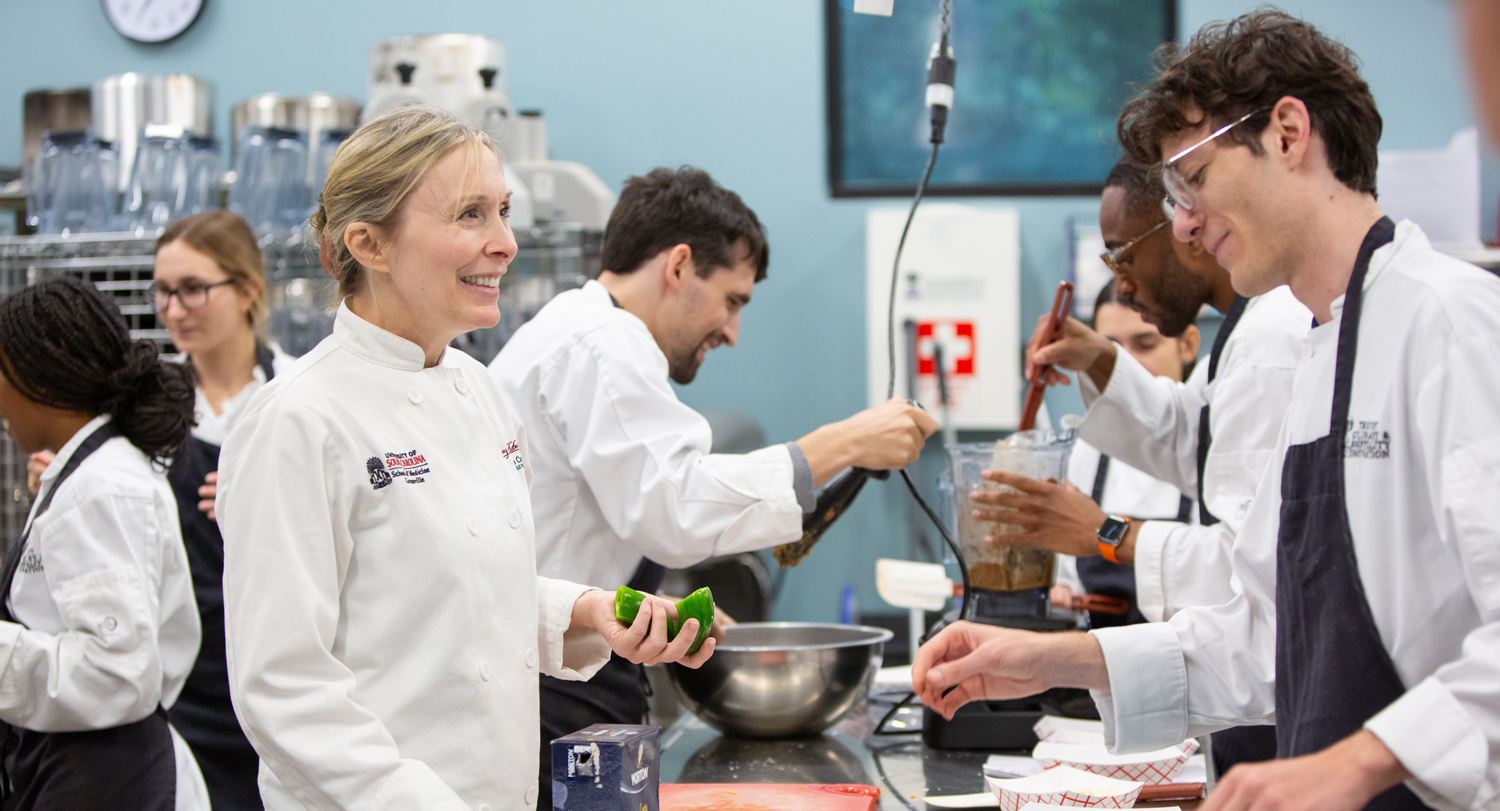 Jennifer Trilk teaches medical students how to prepare healthy meals during the culinary medicine program.