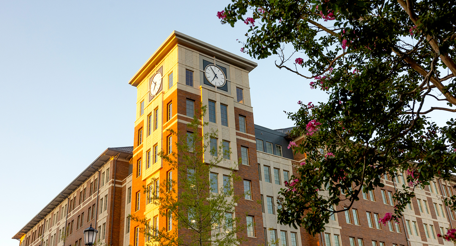 Campus Village building with a clock tower.