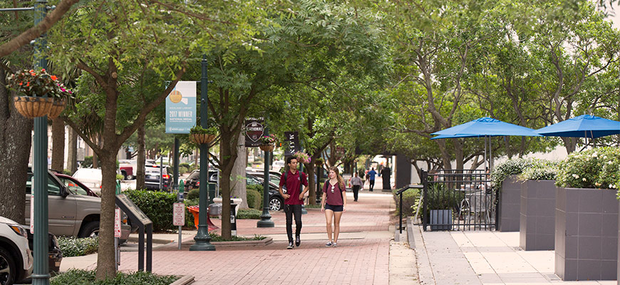 Student walking down Main Street.