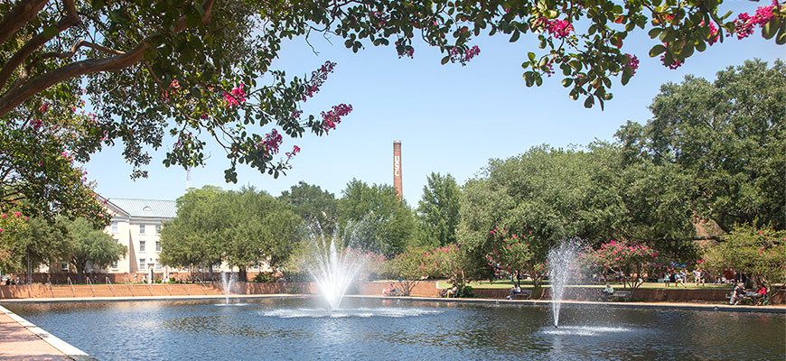 The USC smokestack rises above the Thomas Cooper Library fountain