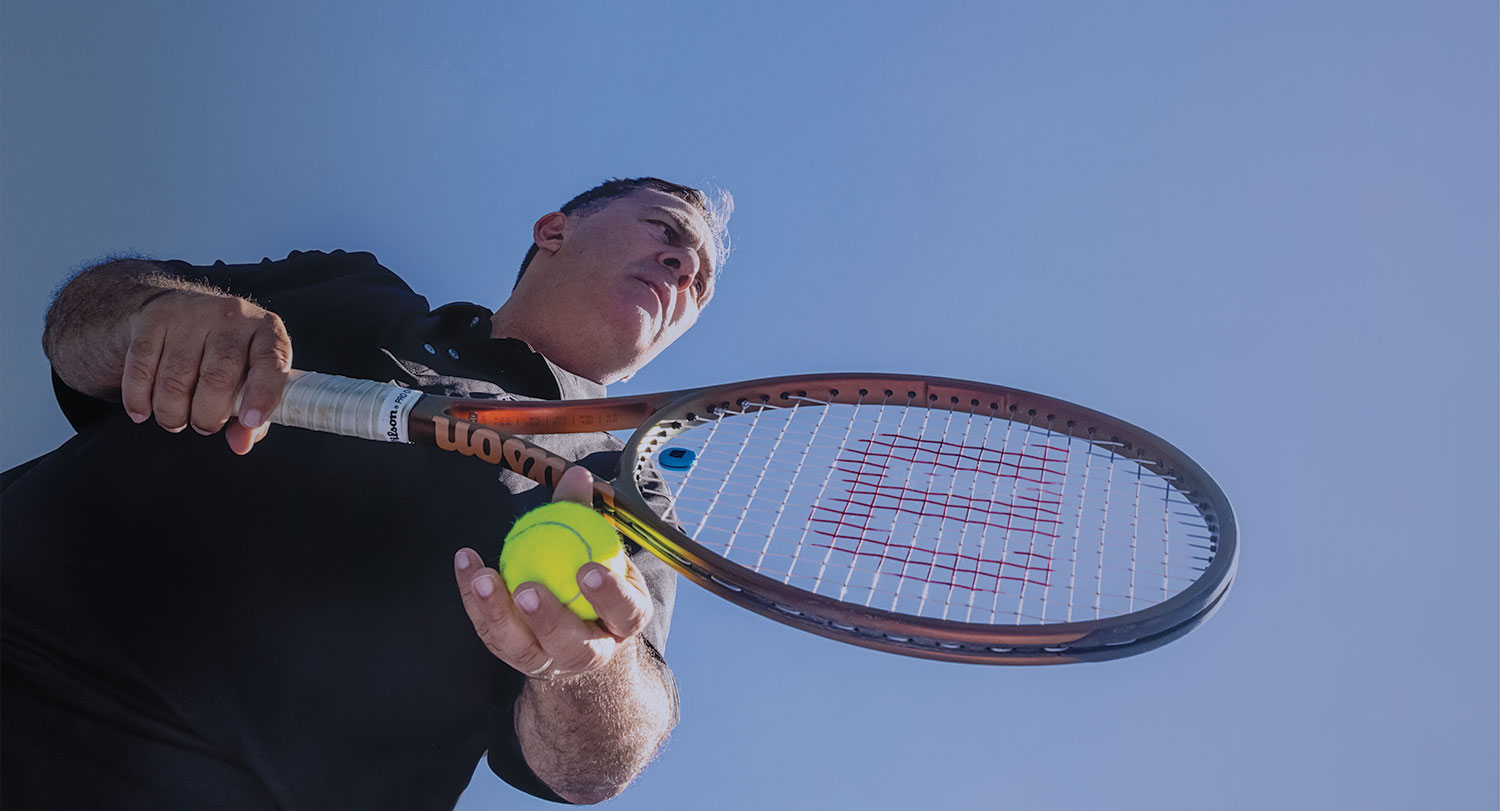 Ricardo Acioly prepares to serve the ball.