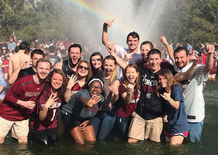 students celebrating in the fountain