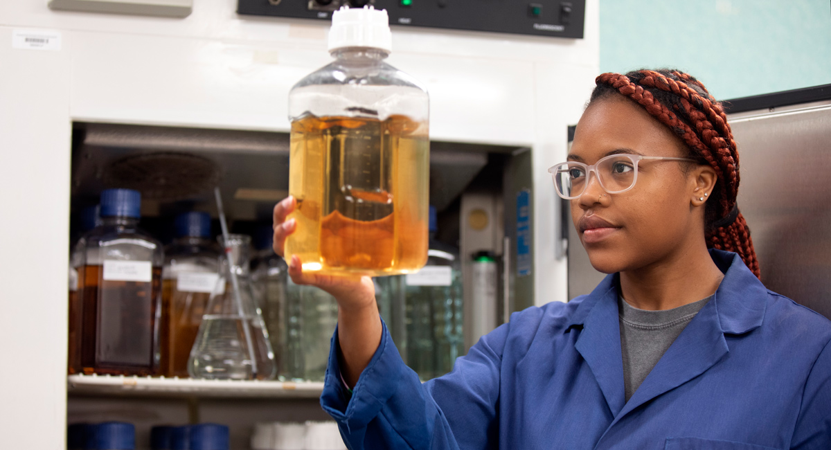 Gwyn Hopper looks at water samples.