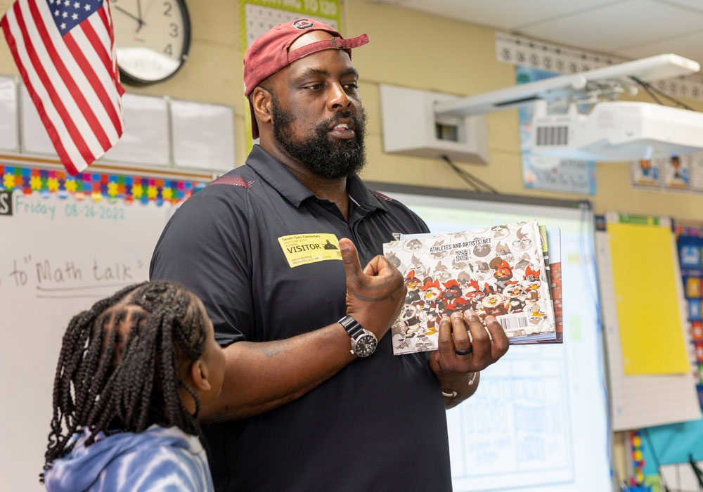Preston Thorne speaks to an elementary school class.