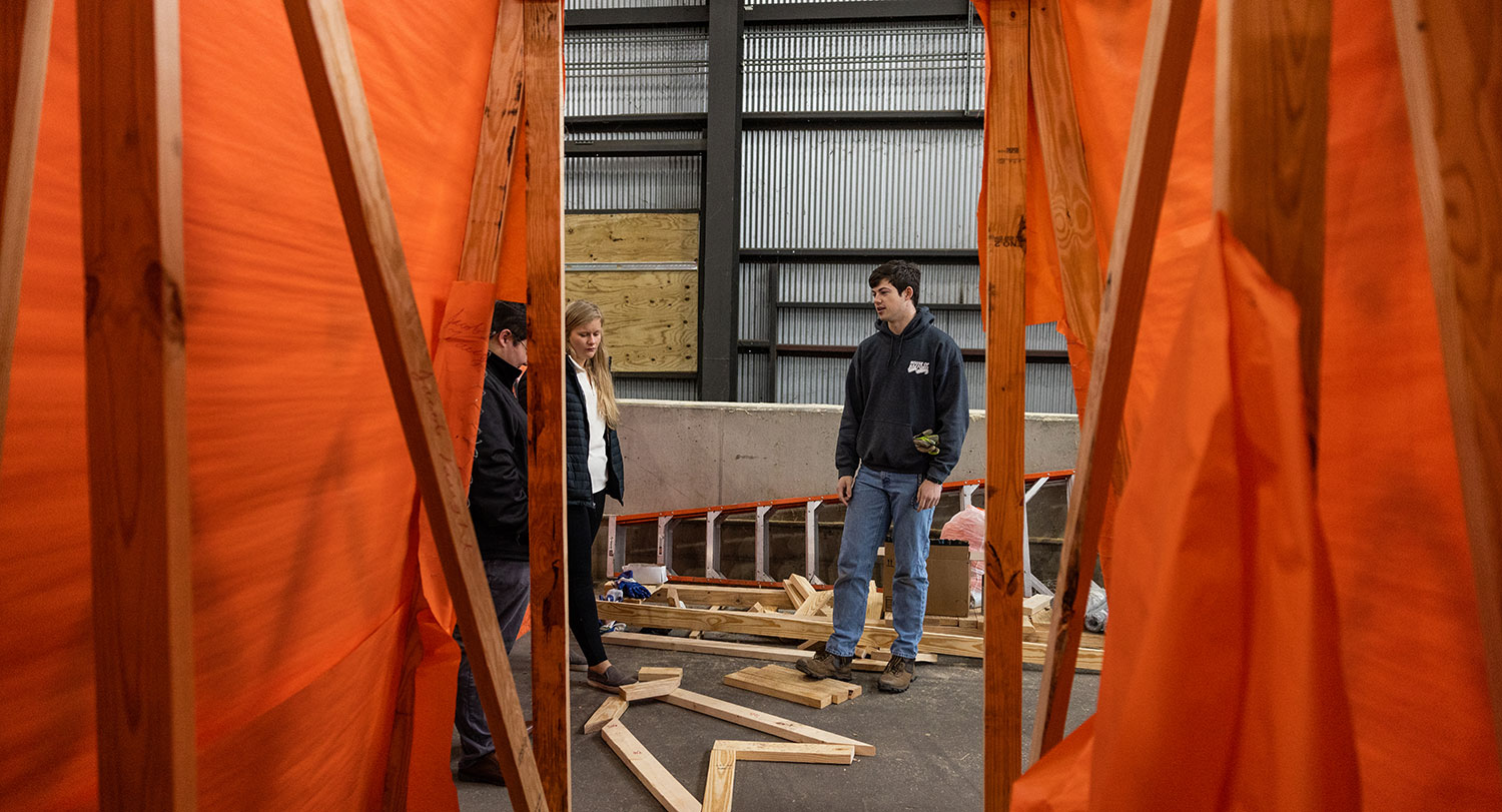 Image of student working and building the tiger for Tiger Burn