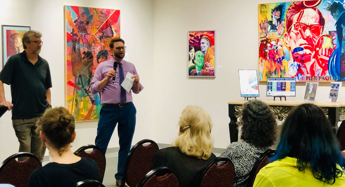 Artist Colin Dodd and Koger Center Director, Nate Terracio speak to a group in the Upstairs Gallery.