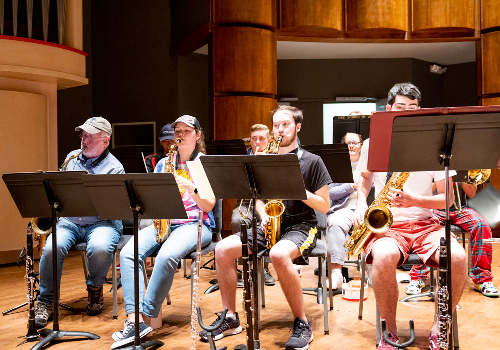 Swing shift big band rehearsal with students on stage.