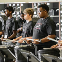 Band students practice drums during summer camp.