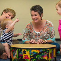 Babies play in music class.