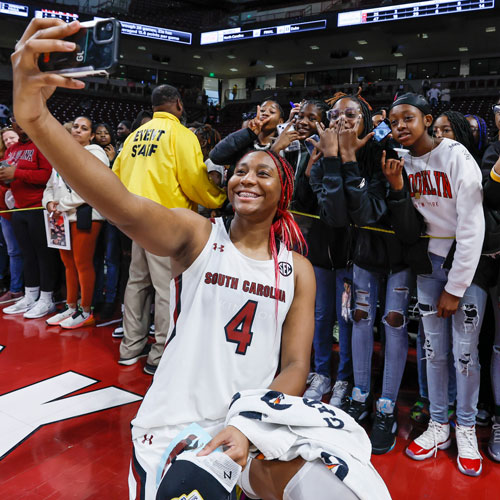 Aliyah Boston takes photos with fans. 