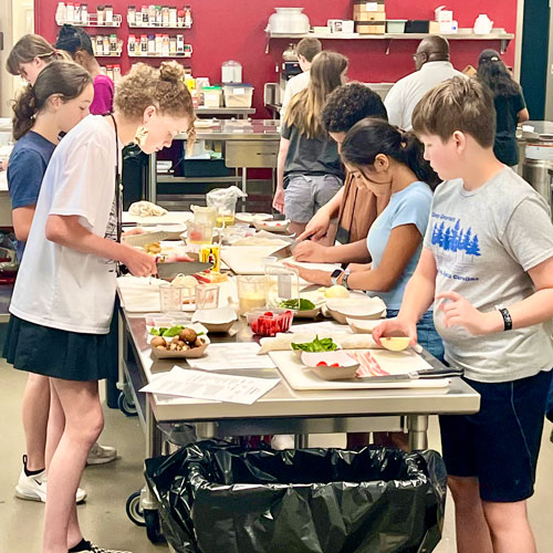 Students work together at CMS culinary arts camp.