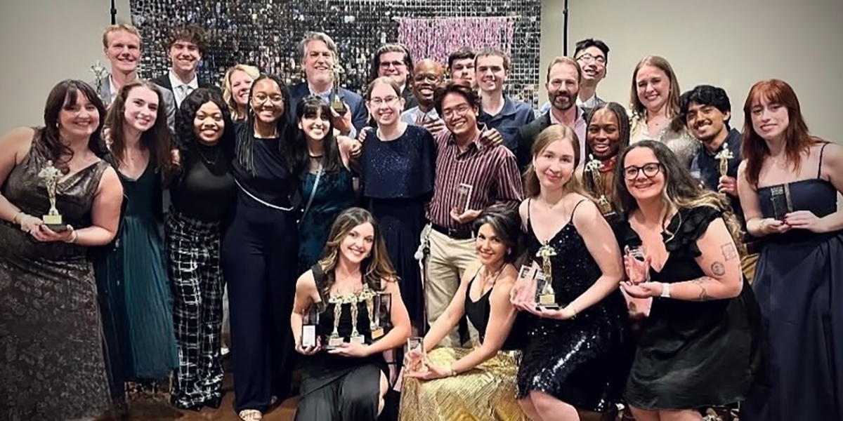 Group photo of students and teacher in formal wear at the ADDY Awards