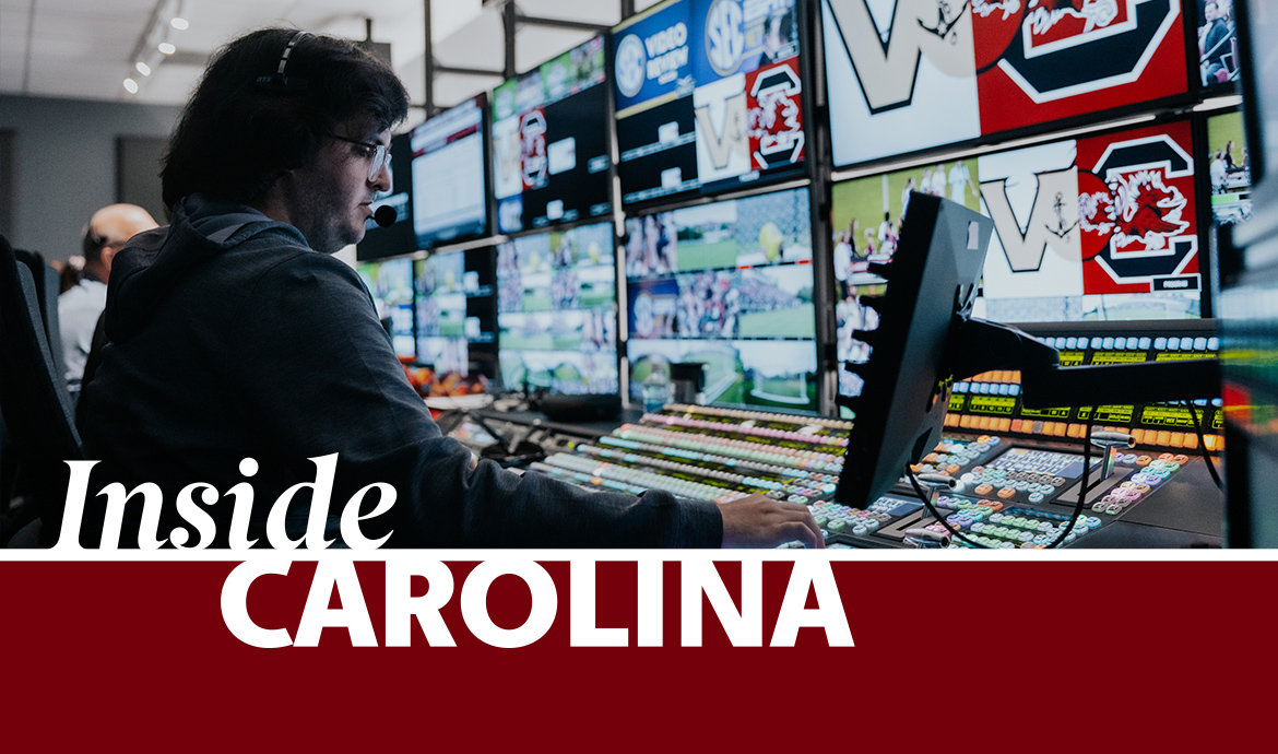 graphic that has a frame with the words Inside Carolina over an image of a man in a suit speaking at a podium with images on screens behind him