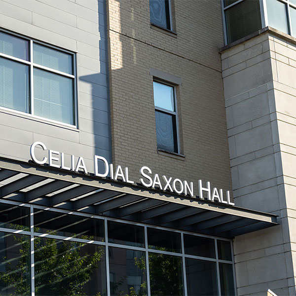 a modern residence hall with the name Celia Dial Saxon Hall