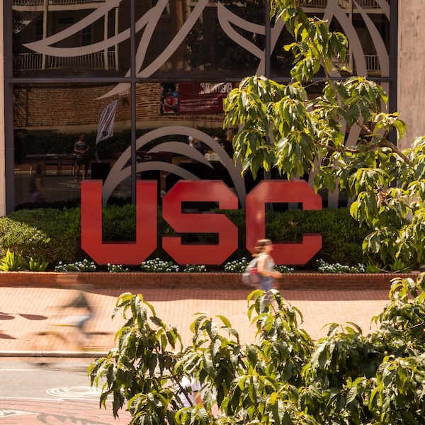 garnet block USC letters in front of Russell House