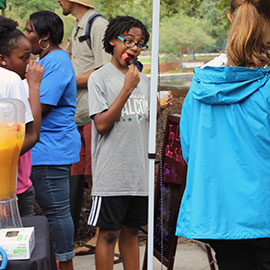 One student indulges in a tasty snack at the Healthy Carolina Farmers' Market.