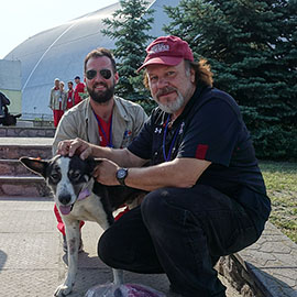 Tim Mousseau and a stray dog at Chernobyl 