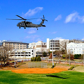 Black hawk helicopter over campus on Engineering Day