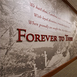 Wall featuring a Forever to Thee mural at Alumni Center