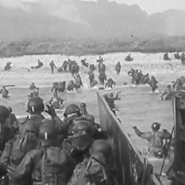 soldiers exiting boats into the beach during WWII 