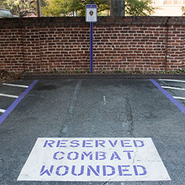 the purple heart parking space painted with its sign
