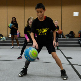 students exercise with a ball