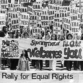 1970s rally of women and men with signs that say ERA Yes 