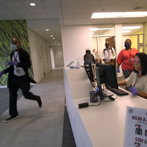 students walk in building on campus