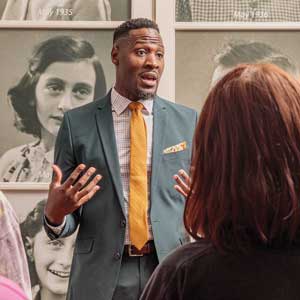Doctoral candidate Devin Randolph gives a tour of the Anne Frank Center