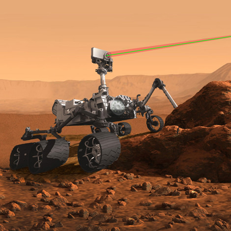 an artist's concept of the Mars rover analyzing rocks on Mars
