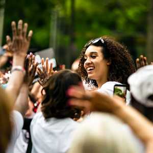 Brea Beal is surrounded by fans as she participates in the parade celebrate the women's basketball team's 2022 national championship