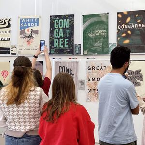 students look at typography exhibit  