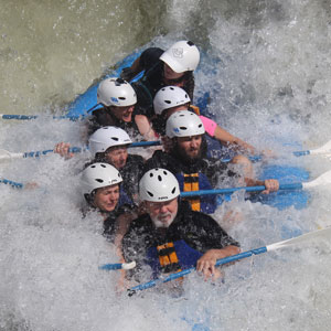 people rafting in whitewater