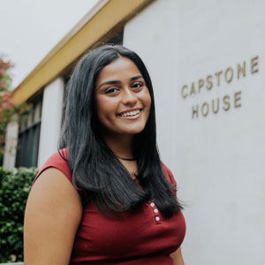 Woman standing in front of Capstone House