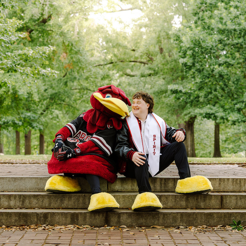 Cocky and Brayden pose on the Horseshoe at the University of South Carolina.