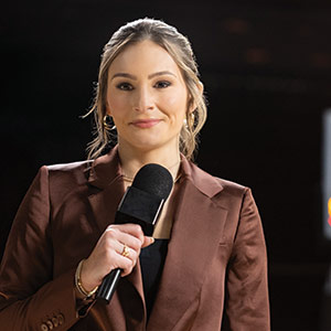 Alyssa Lang holding a microphone
